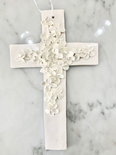 Very unique design for this religious item. Clay Cross Ideas, Polymer Clay Home Decor Diy, Clay Crosses Diy, Pottery Cross, Medallion Wall Art, Crucifix Art, Clay Cross, Ceramic Crosses, Beginner Pottery