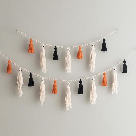 Elevate your Halloween decor with this Ghost Bunting For Mantle--a playful and spooky addition to your home. This charming Boo Garland adds a touch of boho style to any space, making it the perfect Halloween Ghost decoration. Ideal for creating a witchy goth ambiance or as Gifts For Witches. This Macrame Ghost Garland is handcrafted/ hand woven with Natural Friendly Cotton Cord. DETAIL: - Total Length - when stretching: + 2 ghosts + 3 tassels - 31" ~ 78cm + 3 ghosts + 4 tassels - 40" ~ 102cm + 4 ghosts + 5 tassels - 50" ~ 126cm + 5 ghosts + 6 tassels - 59" ~ 150cm + 6 ghosts + 7 tassels - 69" ~ 174cm + 7 ghosts + 8 tassels - 78" ~ 198cm + 8 ghosts + 9 tassels - 87" ~ 222cm + 9 ghosts + 10 tassels - 97" ~ 246cm + 10 ghosts + 11 tassels - 106" ~ 270cm + 11 ghosts + 12 tassels - 116" ~ 294cm Yarn Ghost Garland, Ghost Bunting, Witch Garland, Macrame Ghost, Spooky Wall Decor, Diy Ghost Decoration, Gothic Halloween Decorations, 2 Ghosts, 3 Ghosts