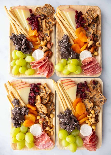 Charcuterie boards are a fun addition to any gathering, but sometimes mini charcuterie boards make more sense than a larger display. Small charcuterie boards are great for events where you want everyone to grab something quickly and mingle, for a movie night where you want everyone to get an even mix of the foods, or for an event where you just want to portion everything out ahead of time. #charcuterie #snacks #entertaining #easyrecipe #mini Mini Cheese Board Ideas, Charcuterie Board For One Person, Charcuterie Plate For One, Small Cheese Board Ideas, Impressive Cookies, Charcuterie For One, Individual Charcuterie Board Ideas, Charcuterie Board Mini, Cookies For A Cookie Exchange