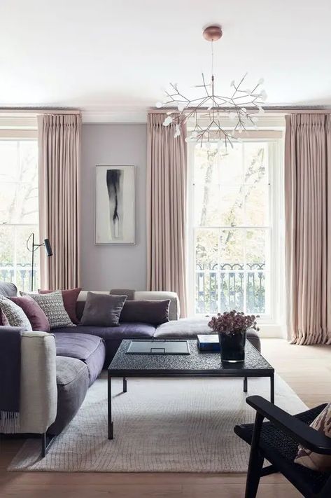 a glam living room with grey walls, a large grey and purple sectional, pink pillows and blush curtains Good Living Room Colors, Furnitur Ruang Keluarga, French Door Curtains, Room Wall Colors, Layered Curtains, Room Wall Painting, Revere Pewter, Living Room Color Schemes, White Upholstery