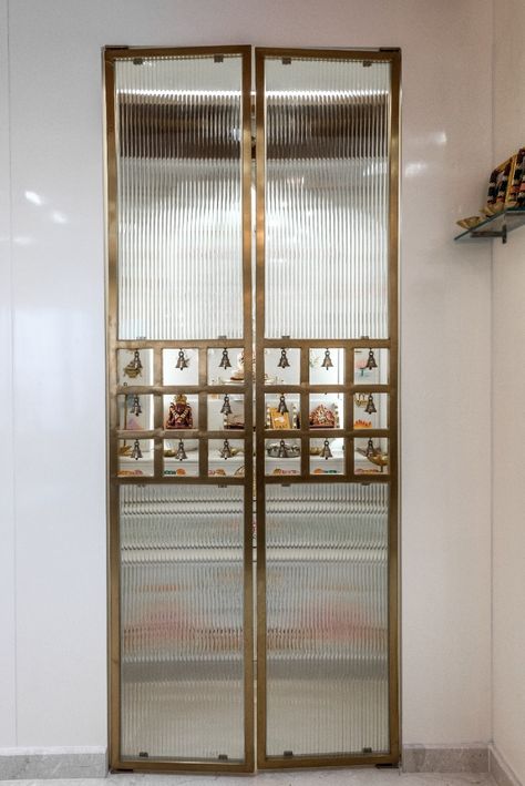 Puja Unit Glass Door Design, Glass Pooja Doors, Fluted Glass Pooja Room Door, Fluted Glass Pooja Door, Puja Glass Door Design, Puja Unit Door Designs, Glass Temple Design For Home, Mandir Glass Door Design Puja Room, Pooja Room Glass Door Designs