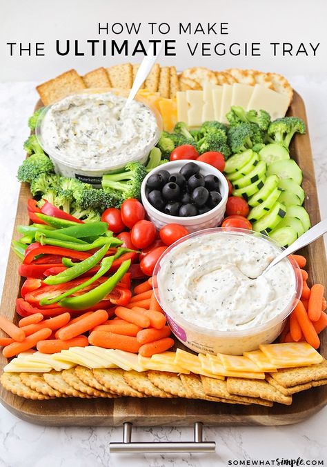 Impress your guests with this beautiful, festive and healthy veggie tray!  This savory appetizer is a perfect compliment to any party.  It's quick and easy to put together, and there's something for everyone to enjoy! #vegetables #vegetabletrayideas #veggietrayideas #vegetabletraydisplay #veggieplatter #veggietray via @somewhatsimple Summer Veggie Tray, Dinner Boards, Charcuterie Ideas, Entertaining Food, Healthy Appetizer, Healthy Veggie, Vegetable Tray, Cold Side, Vegetable Platter