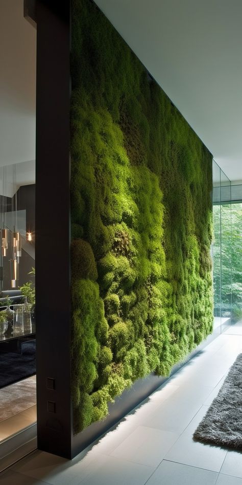 An elegant moss wall room divider, uniting the beauty of nature and contemporary design to create a serene, functional partition in an indoor space. Green Moss Wall, Office Living Wall, Moss Wall Ideas, Greenwall Interior Design, Green Wall Partition, Fake Living Wall, Greenwall Interior, Room With Lots Of Plants, Plant Room Divider