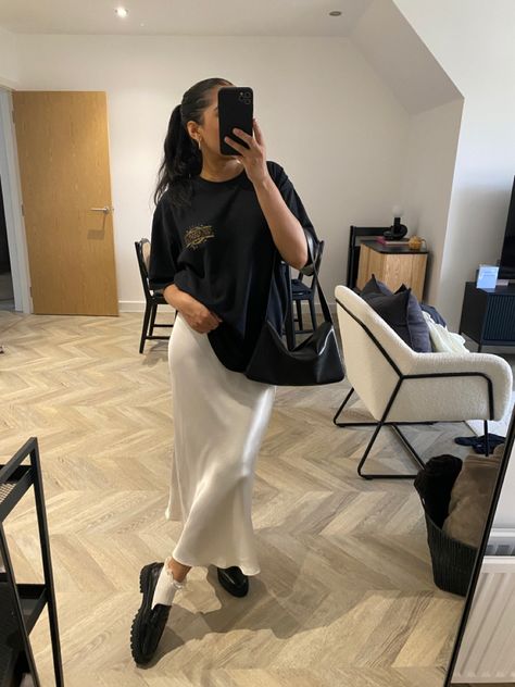 Cream midi skirt, chunky loafers, oversized black t shirt Chunky Loafers Midi Skirt, Silk Skirt And Loafers, Midi Skirt And Loafers Outfit, Chunky Loafers Skirt Outfit, Loafers With Skirt, Winter Style 2023, Cream Midi Skirt, Oversized Black T Shirt, Oversized Shirt Outfit