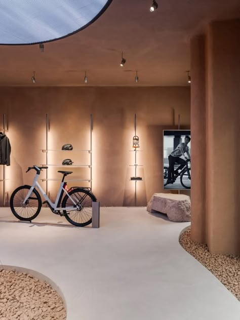 Ciguë imagines car-free city inside Cowboy's electric bike shop in Paris Electric Bicycle Design, Bicycle Room, Shop In Paris, Paris Interiors, Cycle Store, Concrete Walkway, Bike Room, Bicycle Store, Paris Store