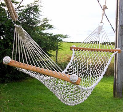 Hammock netted by hand in cotton with ash wood stays, in garden. I think I could make this. Esp. love the monkey fist side rope Hammock Netting, Macrame Hanging Chair, Macrame Hammock, Diy Hammock, Rope Hammock, Rope Projects, Indoor Hammock, Makramee Diy, Farmhouse Landscaping