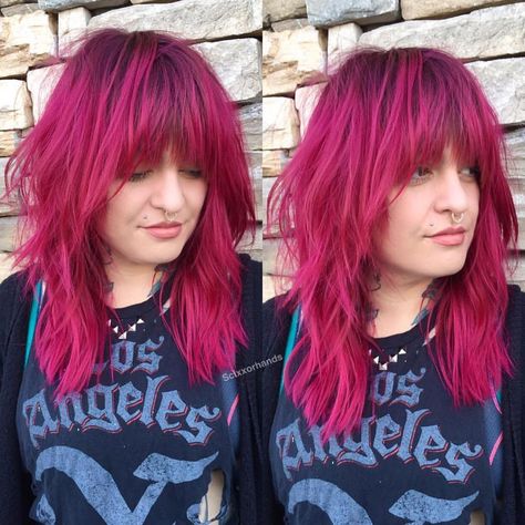 This Edgy Shag Cut with Messy Textured Fringe and Magenta Color with Shadow Roots is a great look for someone seeking a cool eccentric style. This shaggy layered cut can be worn sleek and straight, with textured waves or curls, or with a simple blowout for body and movement. The fun pink hair color and shadow roots give this cut a personal style. Styling tips for this shaggy haircut and other similar long hairstyles and hair color ideas can be found at Hairstyleology.com Hot Pink Shag Hair, Pink Shag Haircut, Dark Pink Hair With Bangs, Magenta Hair Dark Roots, Pink Shaggy Hair, Magenta Hair With Bangs, Layered Punk Hair, Pink Fringe Hair, Pink Hair With Roots