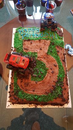 Monster truck themed third birthday sheet cake #cake #birthday #chocolate #food #dessert #yummy #love #baking #foodporn #sweet #recipe Truck Birthday Cake Ideas, Monster Truck Theme Birthday Party, Monster Jam Cake, Monster Truck Birthday Cake, Monster Truck Birthday Party Ideas, Birthday Sheet Cake, Truck Birthday Cake, Truck Birthday Party Ideas, Monster Jam Birthday