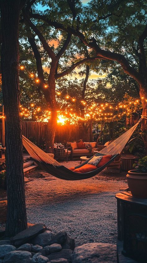 "Sunset Hammock Relaxation: A tranquil backyard setting features a hammock strung between trees, under a canopy of twinkling lights. #sunset #hammock #relaxation #backyard #twilight #aiart #aiphoto #stockcake ⬇️ Download and 📝 Prompt 👉 https://stockcake.com/i/sunset-hammock-relaxation_1176510_1114384 #tranquility #outdoorliving #eveningvibes #serenity #cozyevening" Hammock Ideas Backyard, Tranquil Backyard, Dreamy Farmhouse, Hammock Ideas, Backyard Hammock, Beach Hammock, Future Vision, Twinkling Lights, Twinkle Lights