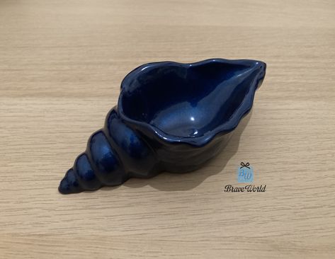 Handmade dark blue conch shell resin trinket dish. Beach themed gifts. Ocean Themed Pottery, Ceramic Board, Clay Shell, Resin Trinket Dish, Ceramica Ideas, Ceramic Shell, The Knick, Conch Shells, Making Stuff