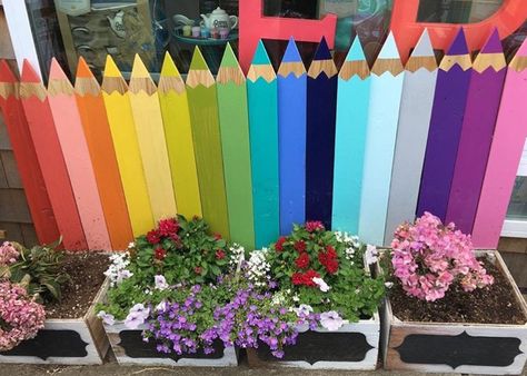 Love the idea of upside down fence posts as colored pencils! Pencil Fence Ideas, Preschool Fence Ideas, School Beautification Ideas Outdoor, Switch Decoration Ideas, Pencil Fence, Switch Board Painting, Kids Garden Play Area, Switch Decoration, Outdoor Learning Spaces