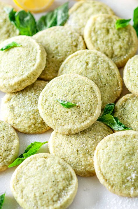 🍋🌿 These pillowy, melt-in-your-mouth lemon basil butter cookies blend sweet and savory into one delightful bite! Tangy lemon adds a zesty twist while a little chopped basil sprinkles a hint of aromatic, refreshing herb flavor. The perfect treat for any time of day, whether it's a post-dinner dessert or a mid-afternoon tea break 🍪! From aberdeenskitchen.com #lemon #basil #butter #sugar #cookies #soft #chewy #tea #baking #afternoon #dessert #teatime Lemon Basil Dessert Recipes, Basil Baking Recipes, Lemon Basil Dessert, Lemon Basil Cookies, Basil Dessert Recipes, Yule Cookies, Lemon Tea Cookies Recipe, Basil Dessert, Lemon Basil Butter