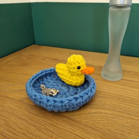 Cutest trinket dish ever?? This cute yellow duck will look after your necklaces, rings and other small bits in its little pond. 🐤 #trinket #trinketdish #trinkettray #trinketdishes #trinketbowl #jewellerystorage #ringholders #ringdish #crochetcore #crochetbirds #crochetinstagram #duckpond #duckponds #ducksarecool #ducksarethebest #ducksarefriendsnotfood #yellowduck #yellowducks #yellowduckling #yellowducky #fundecor #funstorage #fundecorating #uniquegifts #uniquegiftingideas #uniquegiftshop ... Hall Sideboard, Duck Ring, Duck Swimming, Crochet Duck, Crochet Rings, Jewellery Holder, Animal Ring, Crochet Birds, Ring Tray