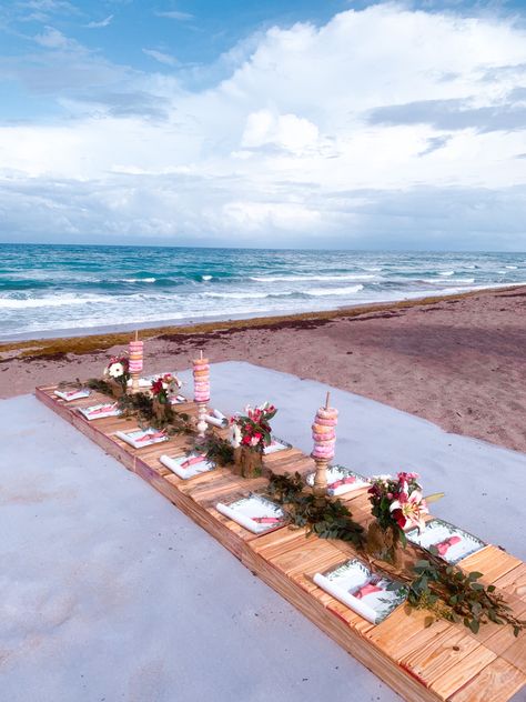 Boho themed beach picnic made from wood palettes, eucalyptus and flower arrangements, super cute party idea! Summer Beach Picnic, Beach Picnic Party, Picnic Party, Beach Picnic, Summer Beach, Flower Arrangements, Party Ideas, Super Cute, Table Decorations