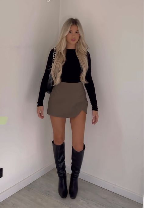 Skirt Going Out Outfit Winter, Skort With Knee High Boots, Skirt High Boots Outfit, Vegas In Spring Outfits, Black Skort Outfit Night, Knee High Boots Outfit Spring, Skirt Knee High Boots Outfit, Short Dress With Knee High Boots, High Black Boots Outfit Winter