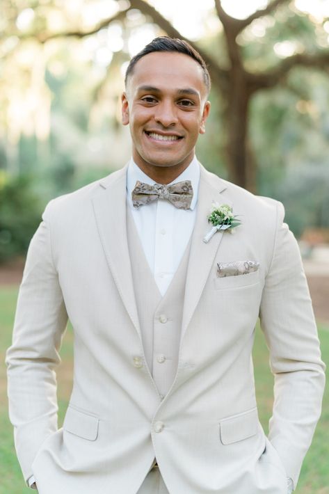 Groom portrait. Groom in tan 3 piece tuxedo with patterned bow tie. Groom With Tie, Tux Colors, 3 Piece Tuxedo, Dip Kiss, White Tuxedo Jacket, Live Oak Tree, Intimate Fall Wedding, Ivory Suit, Fall Wedding Ceremony