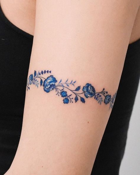 Roses are timeless tattoo motifs. They might vary in color, style, design and meaning, but year after year they remain a solid choice for a variety of... I have butterfly tattoo for you https://shambhusah.gumroad.com/l/Butterfly-tattoo Blue Bracelet Tattoo, Upper Arm Bracelet Tattoo, Sapphire Tattoo Ideas, Blue Tattoos For Women, Sapphire Tattoo, Fingerprint Tattoos, Delicate Flower Tattoo, Colorful Rocks, Timeless Tattoo