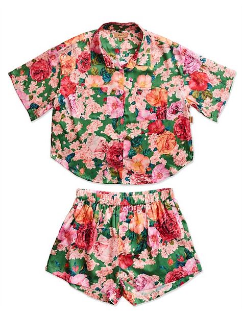 Our smash hit PJs are back in sensational satin style. The Rose Garden Teen Satin Short Sleeve Shirt & Short Pyjama Set blooms beautifully with classic English roses and flourishing florals in the softest peachy pink on a garden green base. This lustrous ensemble marries silky comfort with effortless style. Designed for serene slumbers or leisurely mornings, this button-up shirt and shorts duo is made from 100% recycled eco satin polyester. 100% recycled eco satin polyester. Relaxed fit button up short sleeve pyjama shirt with front patch pockets and matching shorts with elasticised waist and side pockets. Packaged in a 100% biodegradable cornstarch bag. Satin Short Sleeve Shirt, Satin Short Sleeve, Teen Shorts, Satin Style, Satin Short, Shirt And Shorts, English Roses, Pajama Shirt, Peachy Pink