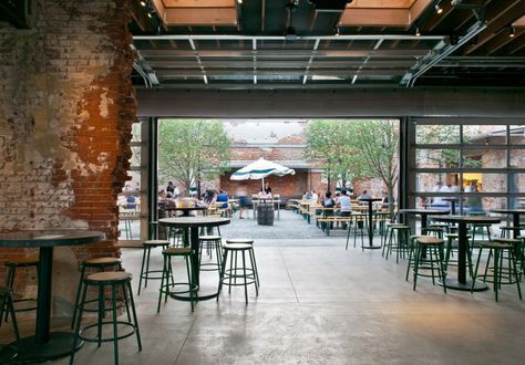 Opens to a beer garden...I'd never get my husband to leave. Modern Brewery Design, Garage Cafe Design, Brewery Design Interior, Taproom Design Brewery, Tap Room Brewery Design, Brewery Bar Design, Garage Brewery, Taproom Design, Brewery Interior Design