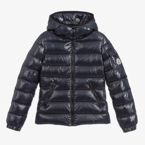 Teen girls navy blue puffer jacket by luxury designer Moncler Enfant, with a glossy finish. This water repellent piece is stamped with the iconic felt logo badge on the sleeve pocket, adding instant brand awareness to this practical outerwear style. Padded with down for cosy warmth, it has a detachable, popper fastening hood for added versatility. There is a smooth zip fastening on the front and zip pockets, both trimmed with black piping for a contrasting, stylish finish. Moncler Jacket Women, Stylish Winter Coats, Blue Puffer Jacket, Blue Puffer, Stylish Blazer, Moncler Jacket, Logo Badge, Stockholm Fashion, Kids Coats