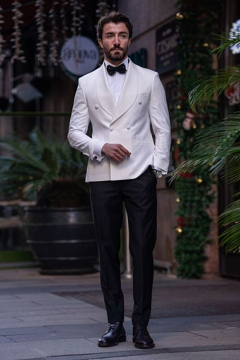 Make a bold statement in the VIOSSI White Double-Breasted Tuxedo 2-Piece. The double-breasted design adds a touch of flair to the timeless white ensemble, ensuring you leave a lasting impression. #whitetuxedo #doublebreastedtuxedo #VIOSSI #mensfashion #timelesselegance #sophisticatedlook #tuxedostyle #classicwhite Indian Tuxedo For Men, Wardrobe Planner, Suit Styles, Double Breasted Tuxedo, Suit Stores, Slim Fit Suit Men, Slim Fit Tuxedo, White Tuxedo, Tuxedo Style