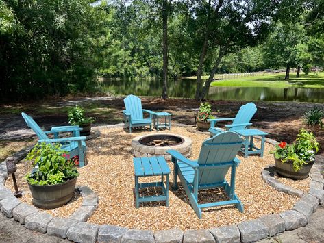 Pea gravel fire pit area with whiskey barrel planters Fire Pit With Gravel Surround, Fire Pit Off Patio, Pebble Fire Pit Area, Pea Gravel Fire Pit Area, Pea Gravel Fire Pit, Gravel Fire Pit Area, Gravel Fire Pit, Whiskey Barrel Planter, Outdoor Fire Pit Seating