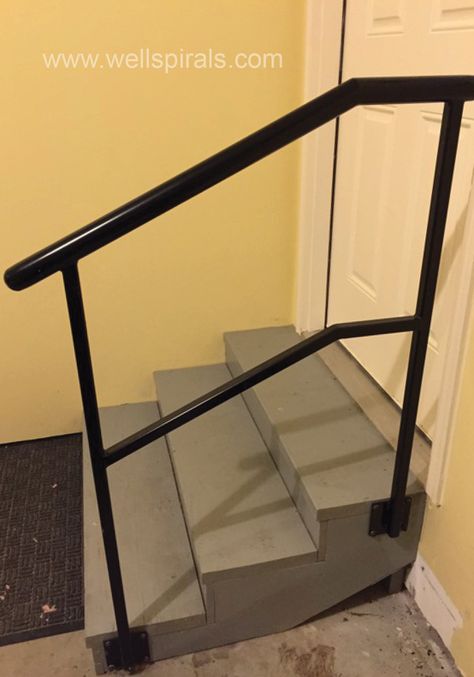 A round handrail features on this simple railing in the garage. Note the side mount. Side Mount Stair Railing, Simple Metal Stair Railing, Garage Stair Railing, Outdoor Stair Railing Ideas, Handrails For Stairs Outdoor, Diy Handrails For Stairs Outdoor, Outside Hand Rails Front Steps, Outdoor Hand Rails For Stairs, Curved Handrails For Stairs Outdoor