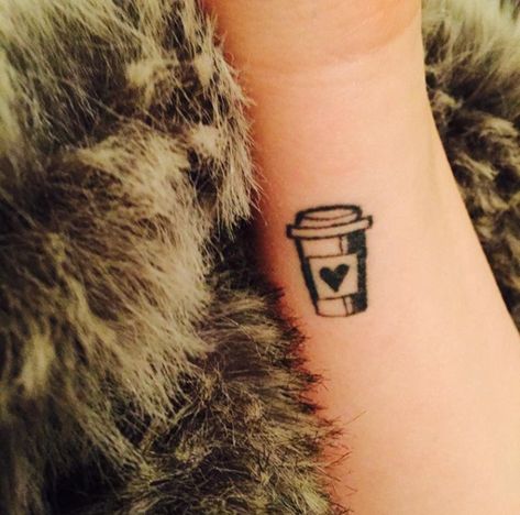 Finger, Wrist, Tattoo, Temporary tattoo, Fur, Natural material, Ink, Close-up, Fur clothing, Animal product, Small Iced Coffee Tattoo, Minimalist Food Tattoo, Iced Coffee Tattoo Minimalist, Iced Coffee Tattoo Ideas, Ice Coffee Tattoo, Iced Coffee Tattoo, Latte Art Tattoo, Coffee Tattoo Ideas, Coffee Cup Tattoo