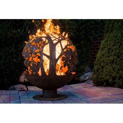 Create a cozy patio setting as you watch the flames dance from this unique fire sphere. | Rosalind Wheeler Herbert Wood Burning Fire Pit Brown/orange 28.0 x 24.0 x 24.0 in | C002643451 | Wayfair Canada Fire Pit Sphere, Fire Pit Gallery, Romantic Centerpieces, Custom Fire Pit, Large Fire Pit, Steel Fire Pit, Cozy Patio, Wood Burning Fire Pit, Wood Burning Fires