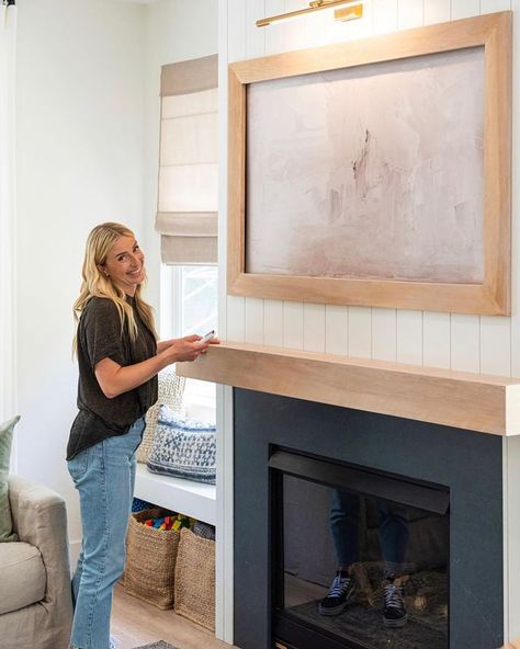 Jasmine Roth HGTV on Instagram: “This isn't just pretty @juniperprintshop framed art... there's a TV hidden behind there!⁠ — This is one of the most-asked-about moments…” Hide Tv Over Fireplace, Tv Hidden, Hidden Tv Cabinet, Tv Hacks, Jasmine Roth, Tv Over Fireplace, Hgtv Shows, Hidden Tv, Custom Built Ins