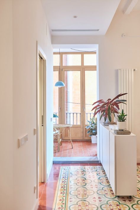 Architect and owner Carlota Siverio wanted to respect the 60sqm/645sqft apartment's 19th-century character, carefully restoring heritage elements. 📍Borrell, Barcelona 📸 Igor Artetxe Cairo Apartment, Barcelona Flat, Apartment Barcelona, Cement Tile Floor, Old Wooden Doors, Barcelona Apartment, Bright Apartment, Duplex Apartment, Small Windows