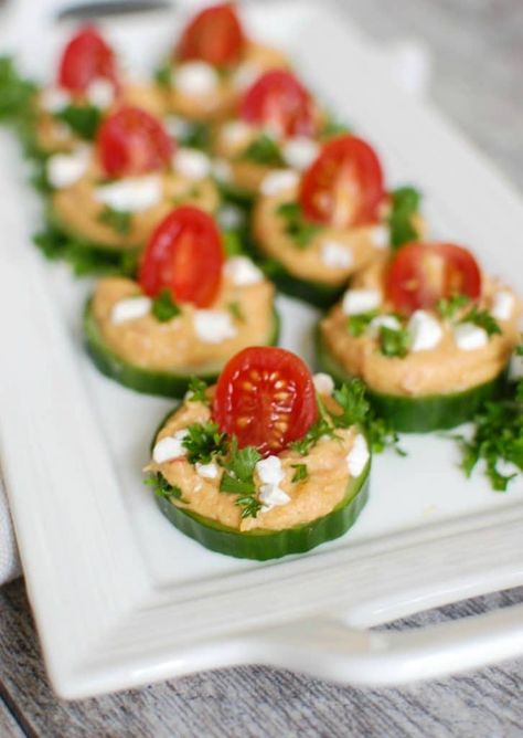 Cucumber Hummus Bites make the perfect finger food and appetizer for your next party or get together. Crisp cucumbers slices are topped with roasted red pepper hummus, tomatoes, feta cheese and fresh parsley. Cucumber Hummus Bites, Easy Finger Food Ideas, Hummus Bites, Cucumber Hummus, Easy Finger Food, Mediterranean Appetizers, Finger Food Ideas, Holiday Appetizers Easy, Cucumber Bites