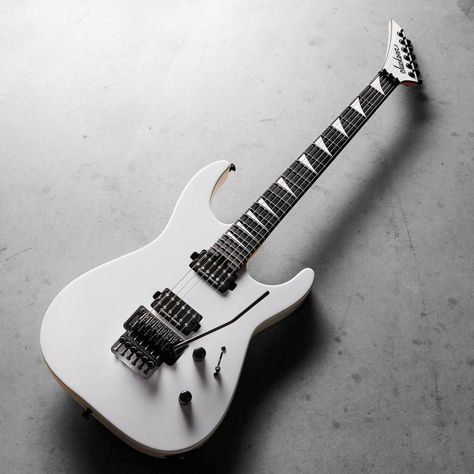 Jackson Guitars on Instagram: “Delivering classic Jackson attitude, the MJ Series Dinky DKR MAH is finished in Snow White with a color matched reverse pointy headstock…” White Electric Guitar Aesthetic, White Guitar, Black And White Electric Guitar Aesthetic, Jackson Guitars Wallpaper, Bass Guitar White, 80s Glam Rock, Silver Electric Guitar, Jackson Electric Guitars, Jackson Guitars