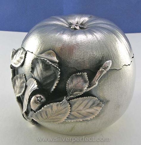 Very unusual Gorham sterling apple tea caddy with hinged lid and textured surface. The lid fits together with the base with a jagged irregular seam as if the apple had been peeled open. Dated 1883 Silver Apple, Gorham Silver, Apple Tea, Silver Tea, Tea Tins, Antique Tea, Tea Caddy, Tea Strainer, Leaf Decor