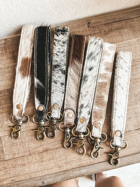 Out West Cowhide Wristlet Keychain – L&L Boutique Cute Western Keychains, Western Key Chain, Cowhide Keychain Diy, Western Boutique Ideas Products, Western Car Accessories Cowgirl Bling, Western Keychain Ideas, Western Lanyard, Western Car Decor, Western Keychains