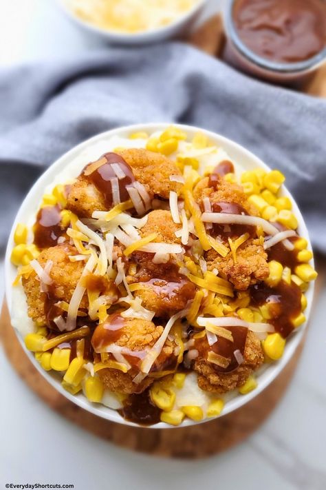 KFC Famous Bowl Copycat Recipe - Everyday Shortcuts Kfc Famous Bowl Recipe Casserole Easy, Healthy Kfc Bowl, Homemade Kfc Bowl, Kfc Famous Bowl Recipe Copycat, Healthy Kfc Famous Bowl, Diy Kfc Famous Bowl, Shredded Cheese Recipes, Kfc Mashed Potato Bowl, Kfc Bowls