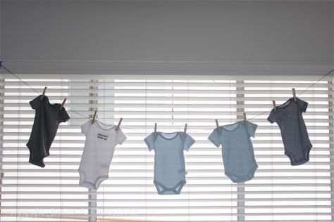 hanging onesies Onesie Garland, Baby Boy Shower Decorations, Baby Shower Appetizers, Shower Appetizers, Garden Baby Shower Theme, Star Shower, Baby Shower Decorations For Boys, Twins Baby Shower, Baby Boy Onesies