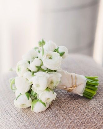 RANUNCULUS BOUQUET  The bridal bouquet consisted of white ranunculus and was finished with gold cord around the stems. Ranunculus Wedding, Bouquet Pastel, Ranunculus Bouquet, Fall Barn Wedding, White Ranunculus, Restaurant Wedding, Martha Stewart Weddings, Boracay, Bride Bouquets