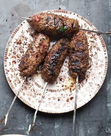 Kafta (Lebanese Beef Kebabs) Recipe | SAVEUR Kebab Recipes Beef, Arabisk Mad, Beef Kebabs, Lamb Kebabs, Lebanese Cuisine, Grilled Sausage, Kebab Recipes, Eastern Cuisine, Lebanese Recipes