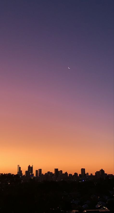 City scape with sunset going from blue, purple, pink, orange, yellow gradient. Moon in right hand corner. Light Sunrise Aesthetic, City Sunset Aesthetic, City Sunset, God's Glory, City Of God, Beautiful Flowers Photography, Sunset Background, Sky Wallpaper, Sunset City