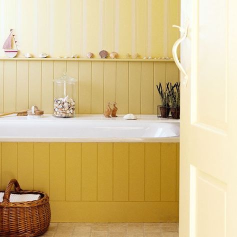 The wood border for the tub, the wallpaper and wall paneling are examples of vertical lines in this picture. Tongue And Groove Panelling, Cosy Cottage, Country House Interior, Wooden Wall Panels, Decorating Advice, Country Style Decor, Country Interior, Yellow Bathrooms, Country Homes