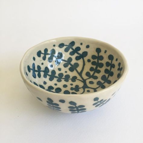 Harlinah Teoh on Instagram: "A little rice bowl with dotty foliage. The teal underglaze is painted on, then slowly carved back to reveal the design and the pale clay underneath." Rice Bowl, Rice Bowls, Surface Design, Instagram A, Rice, Carving, Bowl, Ceramics, On Instagram