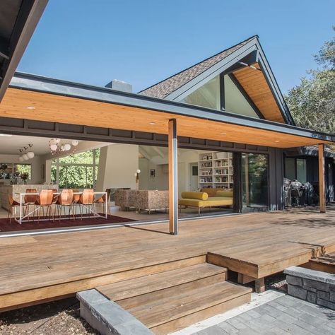 75 Mid-Century Modern Black Exterior Home Ideas You'll Love - February, 2024 | Houzz Black And Wood House Exterior, Mid Century Modern Deck, Modern Black Exterior, Treehouse Inspiration, Mid Century Outdoor, Modern Ranch House, Mid Century Modern Exterior, Mid Century Exterior, Modern Deck