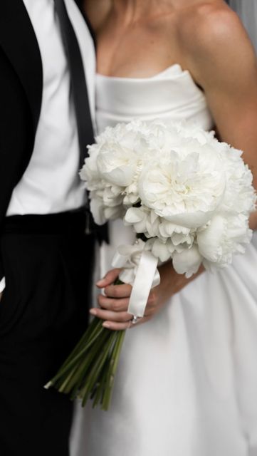 Jess (Adamson) Einaudi on Instagram: "I’ve gotten so many questions about my bridal bouquet! Done by @nerofiore_dallemiemani I chose a simple arrangement of white peonies - #wedding #weddinginspiration #weddinginspo #weddingplanning #bridal #bridalbouquet #weddingflowers #weddingvenue #weddingdress #italianwedding #tuscanwedding #bride #florals #floraldesign #floralarrangement #bouquet #peonies" White Peony Bouquet Wedding, White Bridal Flowers, White Peonies Bouquet, Bridal Bouquet Peonies, Peony Bouquet Wedding, Simple Bride, February Wedding, White Bridal Bouquet, So Many Questions