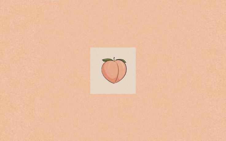 an apple on a peach colored background