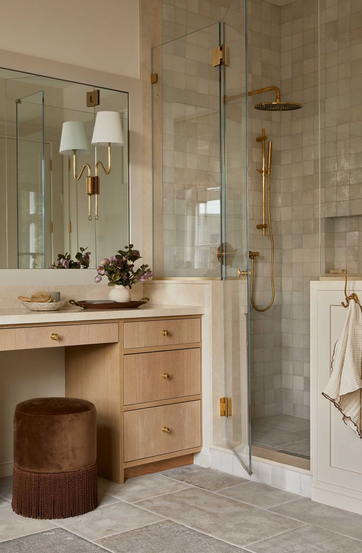 a bathroom with a sink, mirror and bathtub next to a walk in shower