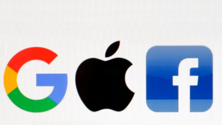 an apple logo and google logos are seen in this illustration taken on march 29, 2013