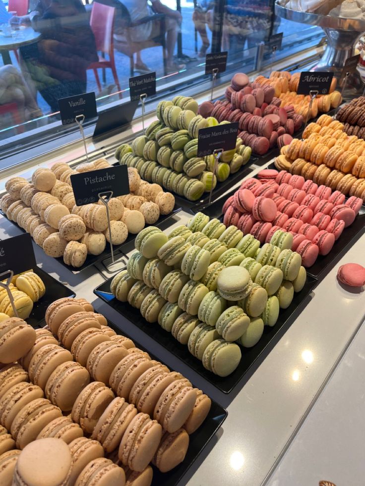 a display case filled with lots of different types of macaroons