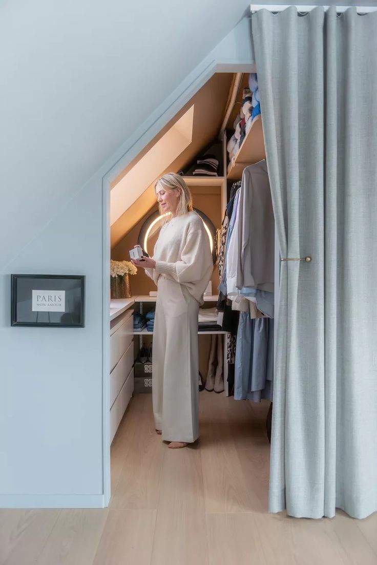 a woman standing in front of a closet