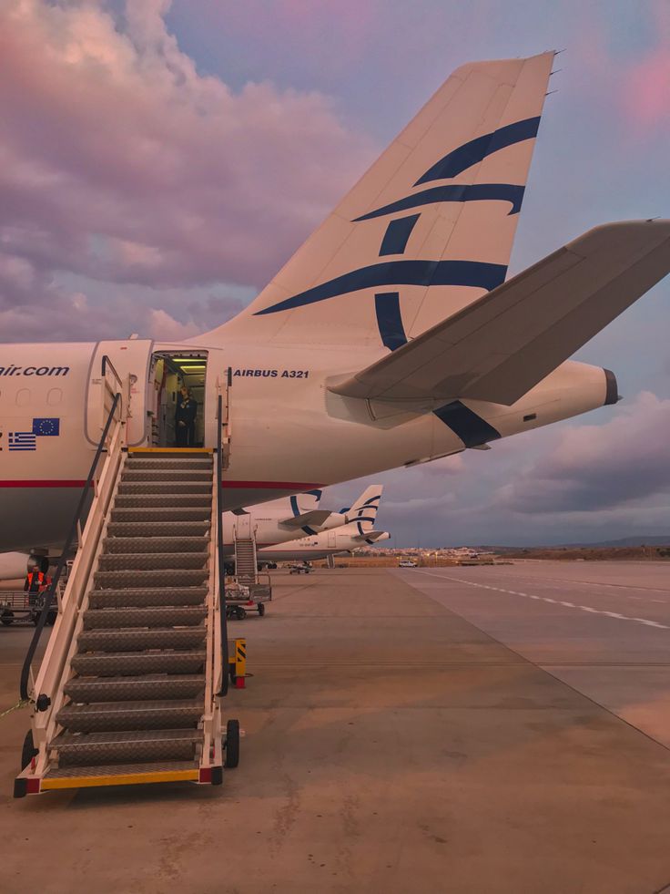 an airplane with stairs leading up to it